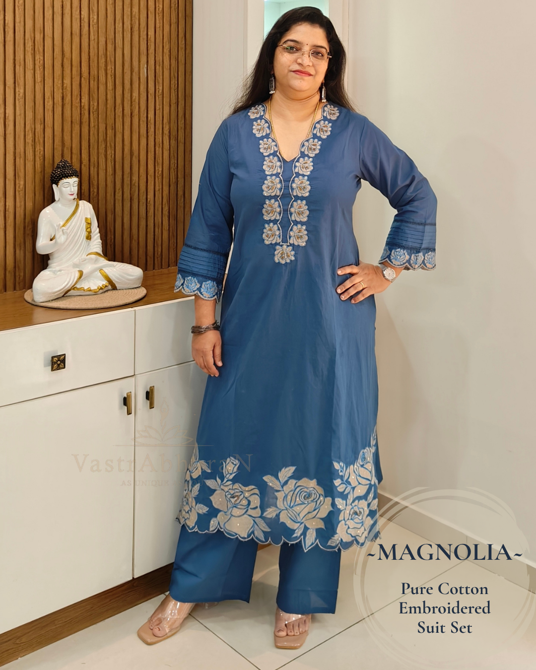 Blue cotton top with 3/4 sleeves and floral embroidered cuffs